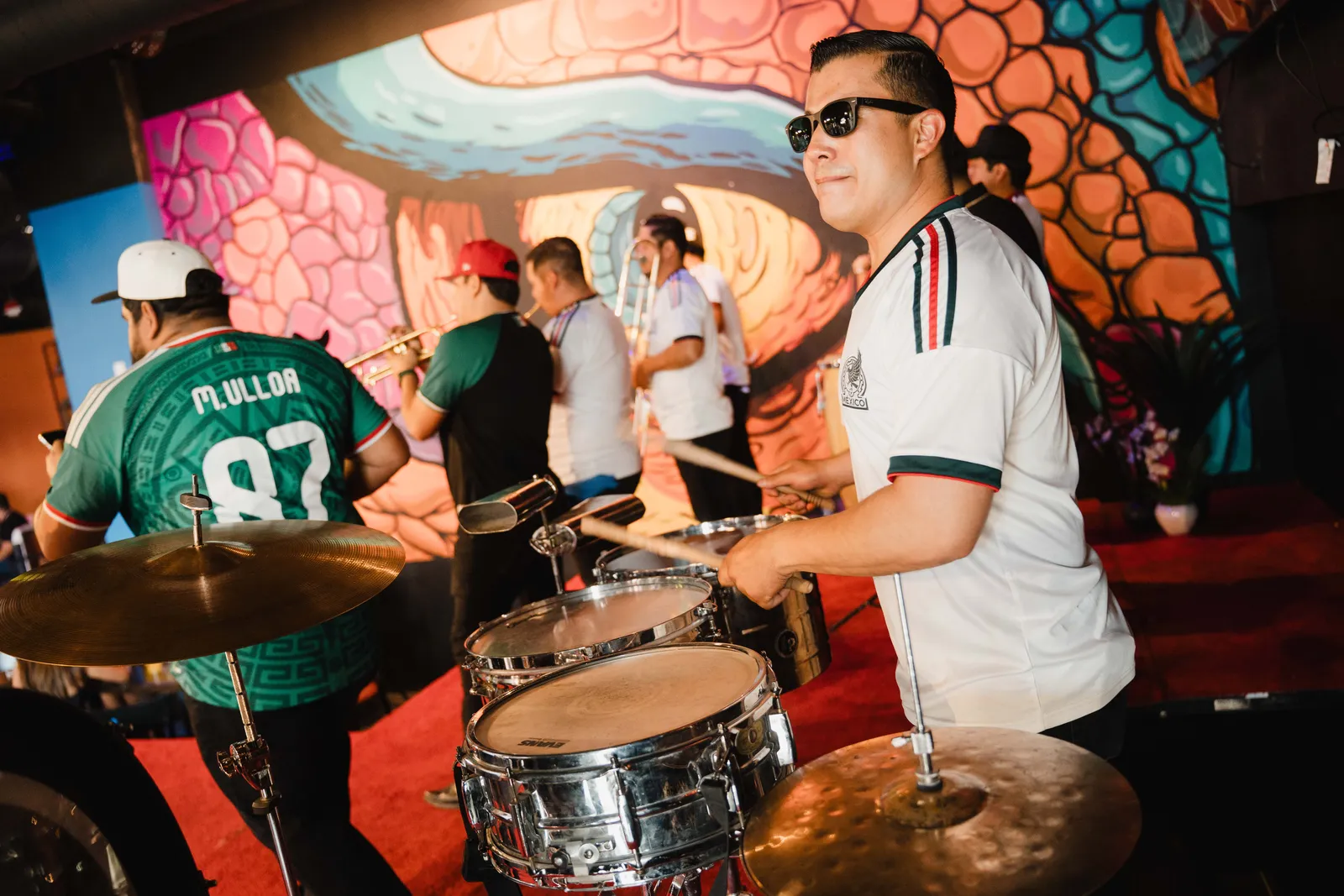 Drummer performing live at Alebrijes