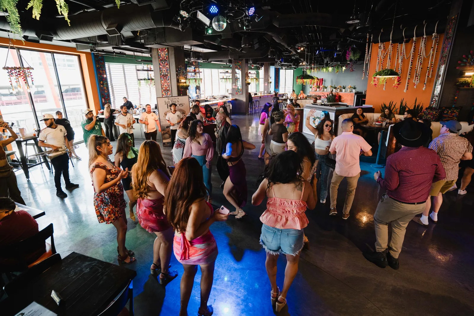 Guests dancing at Banda y Brunch inside Alebrijes